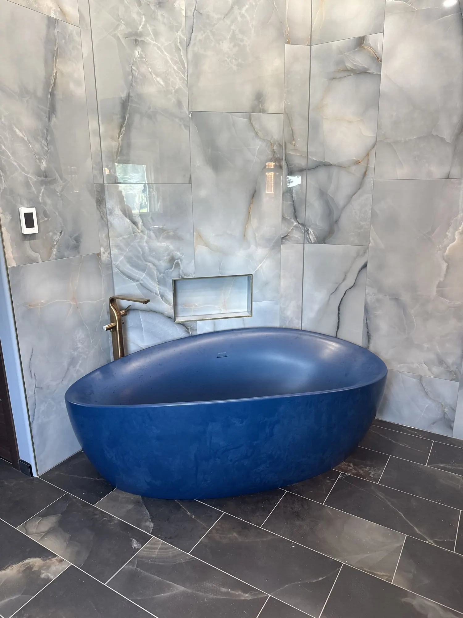 Kansas City primary bathroom remodel with custom vanity and freestanding tub