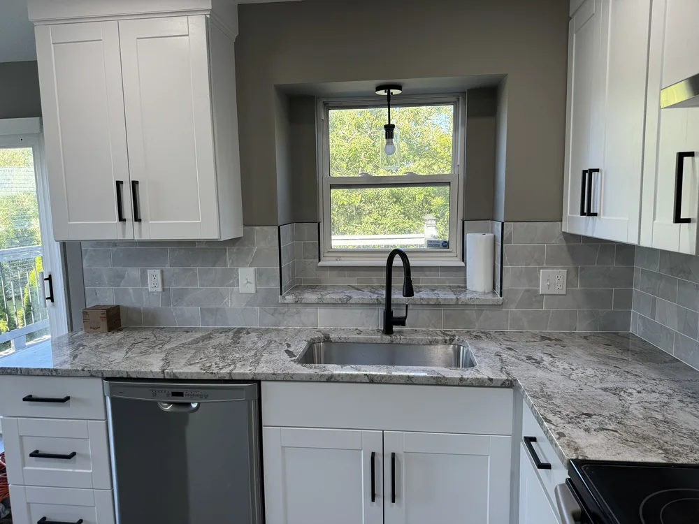 Kitchen remodel in Blue Springs, MO with finished granite windowsill over the sink