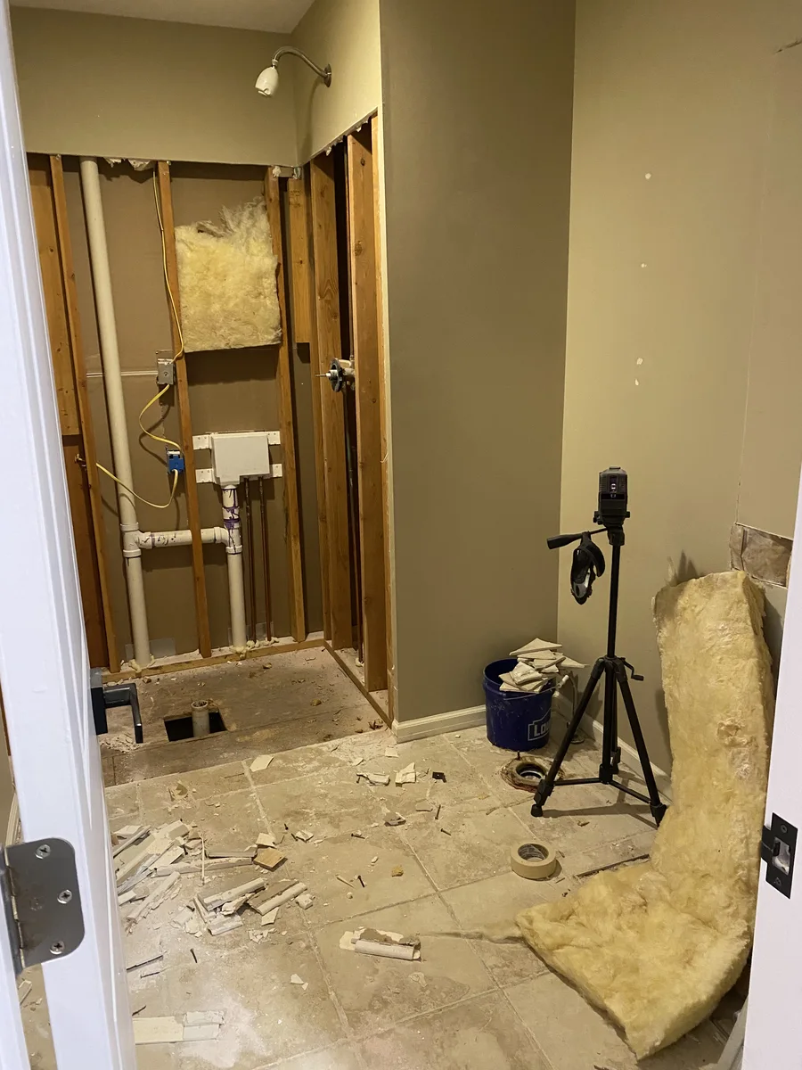 Bathroom remodel in Kansas City, MO — demolition showing removal of the framed build-out that held the original shower insert