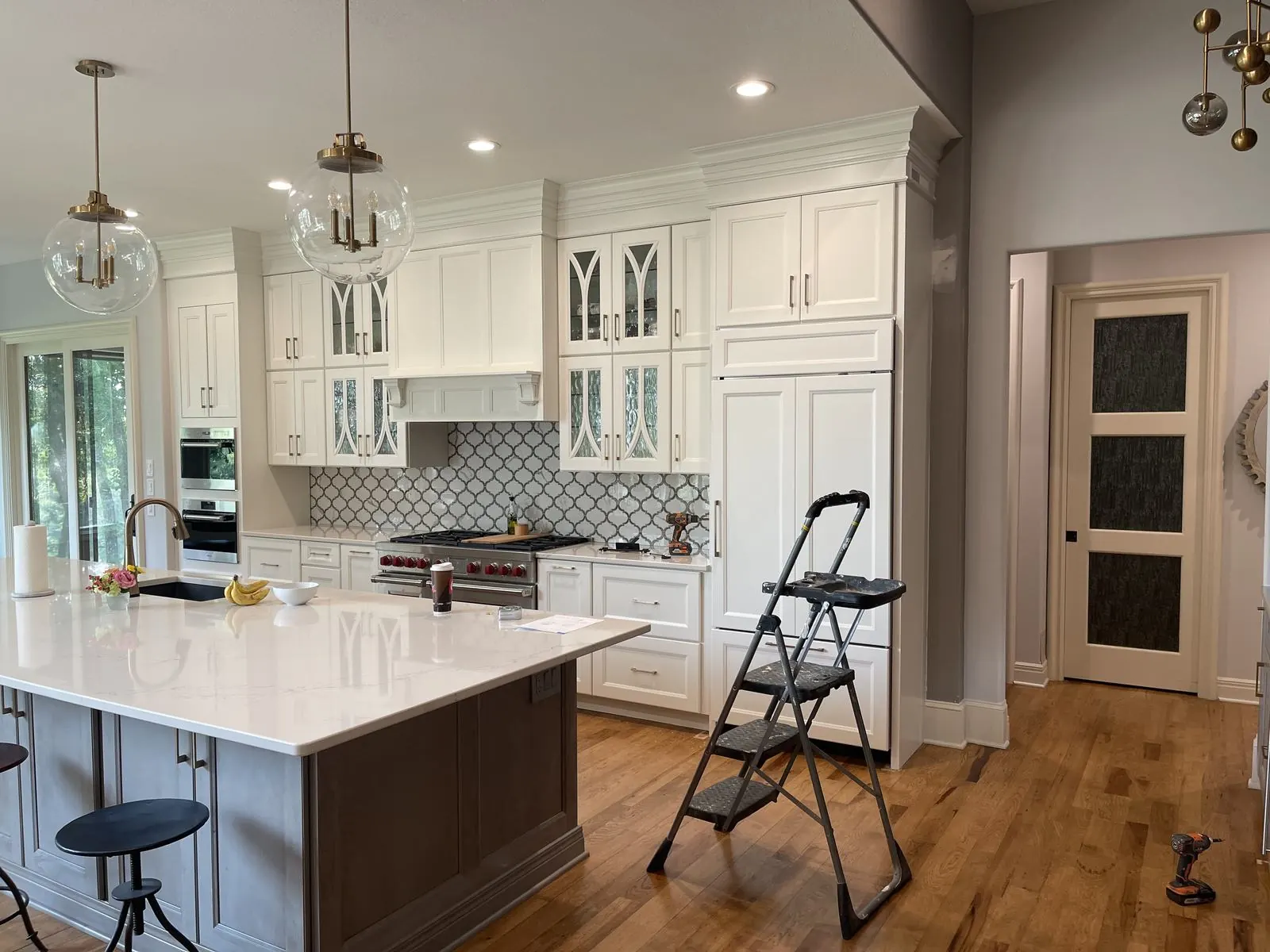 Kitchen mid-renovation showing cabinetry installation in progress