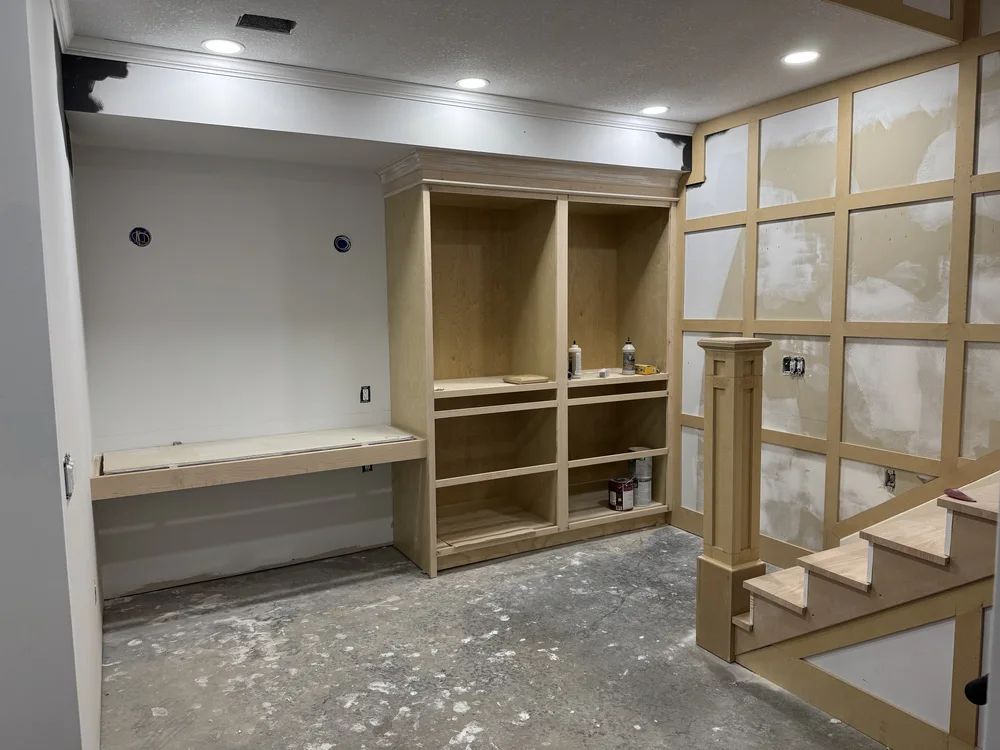Basement renovation in Lone Jack, MO — built-in desk and craft storage cabinets under construction