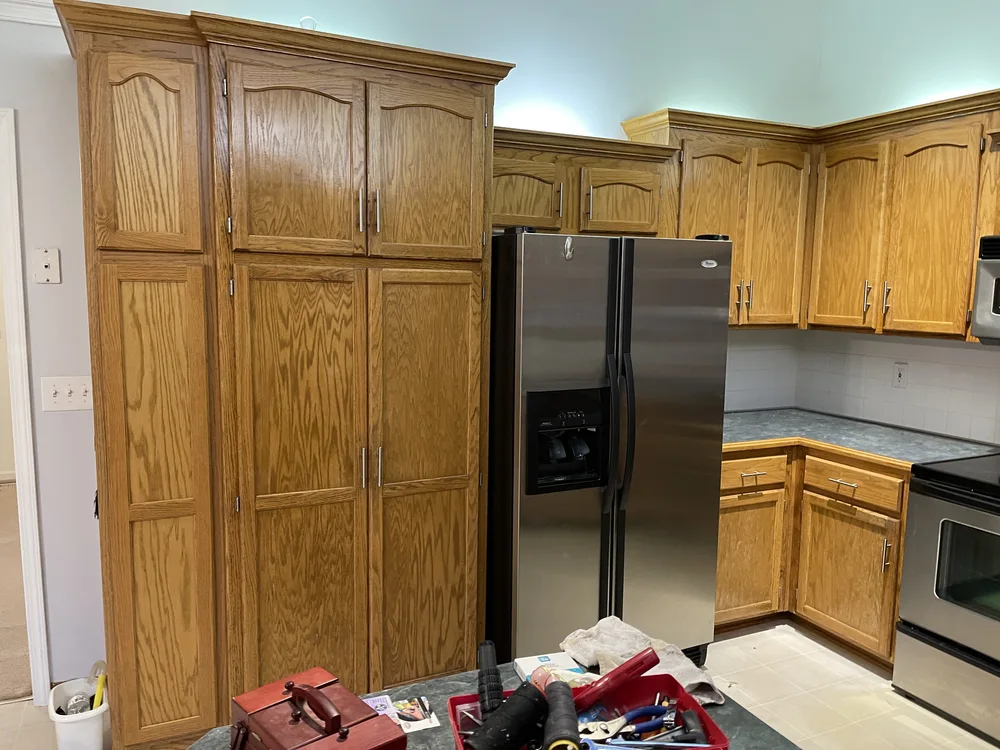 Whole-home remodel in North Kansas City, MO before renovation with original oak cabinetry